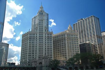 Photograph of a series of large office-looking buildings, one which looks old and others that appear modern.