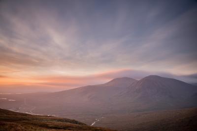 Photograph of a hazy sky over a striking landscape. (Image by worldoflard | Flickr)