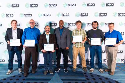 Members of the 19-author team of the Simple Cloud Resolving E3SM Atmosphere Model (SCREAM) present at the Gordon Bell Awards ceremony at the SC23 in Denver on November 16, 2023. From left: Mark Taylor (lead author), Noel Keen, Sarat Sreepathi, the SC23 Committee Chair Dorian C. Arnoldt, Peter Caldwell (SCREAM team lead), Luca Bertagna, and James White. (Photo: SC Photography)