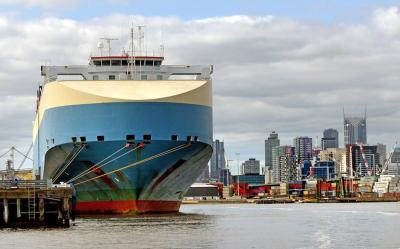 The image shows Port of Melbourne which is Australia's busiest port for containerized and general cargo. Over 80% of the volume of international trade in goods is carried by sea.