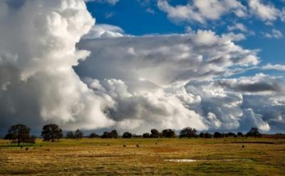 Clouds over landscape.