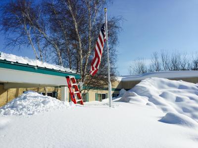 Snow reaches roof heights after a lake-effect storm in Buffalo.