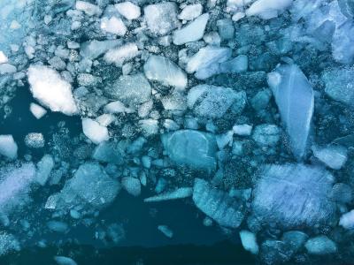 photo of large pieces of ice floating in water