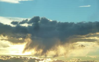 large clouds with the sun behind them