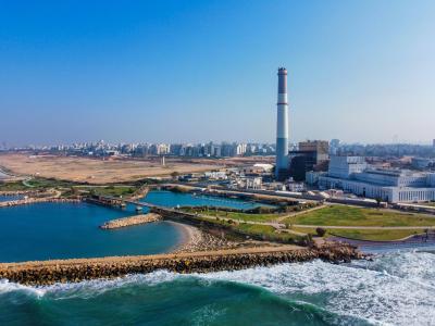 Clear sky over city with factory on shore