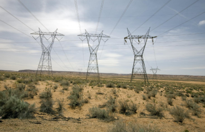 Power lines over an arid landscape. 