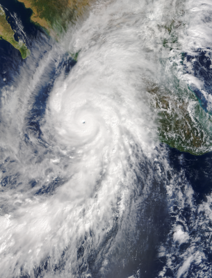 Tropical cyclone over ocean and land