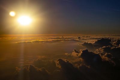 sun over clouds